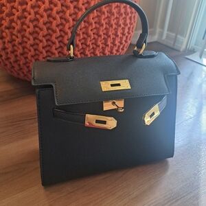 Elegant Black Handbag with Gold Accents